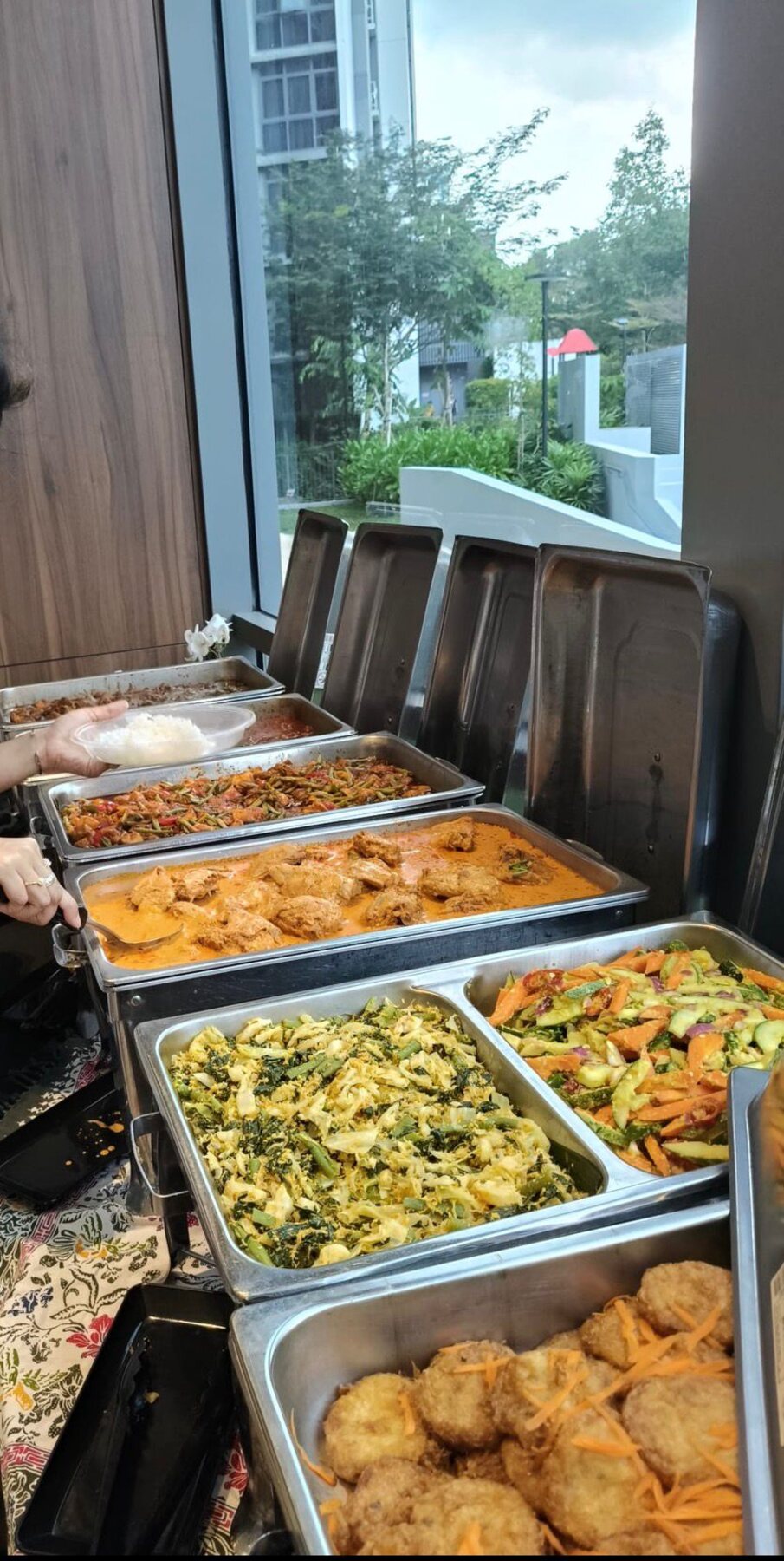Sabar Menanti catering trays laid out and ready to serve, rendang, sayur lodeh, bagedil and more